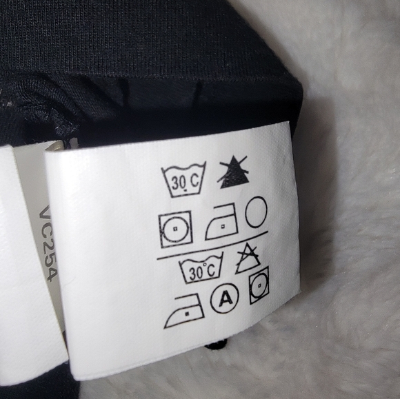 Chaps Black Polo with Tan Emblem Design - Picture 6 of 9